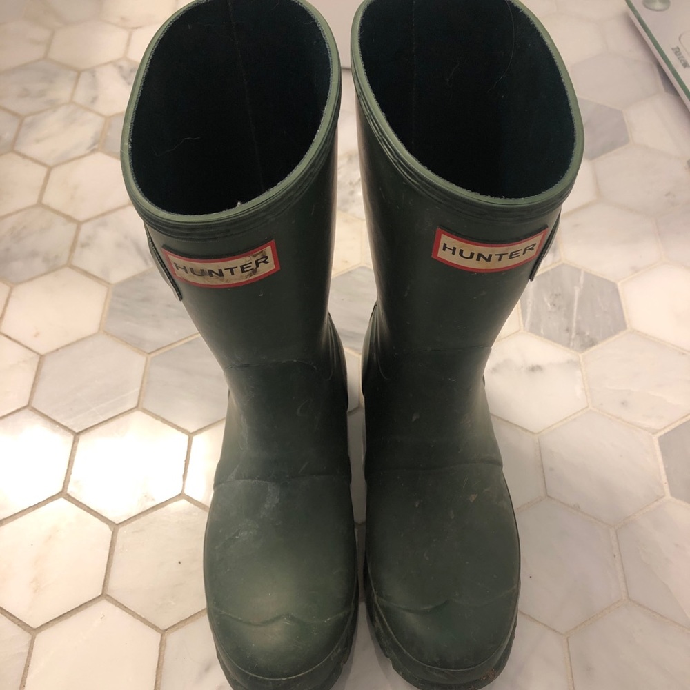 Tall green rubber boots